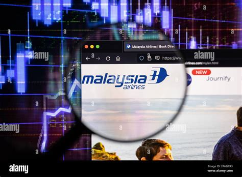 Malaysia Airlines Company Logo On A Website With Blurry Stock Market