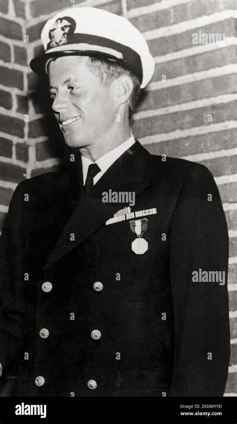 JFK - Photograph of Lieutenant John Fitzgerald Kennedy in Navy uniform wearing Navy and Marine ...