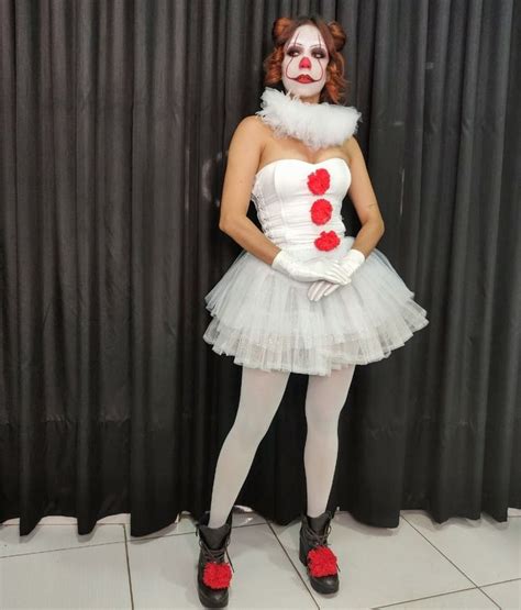 A Woman Dressed As A Clown Posing For The Camera