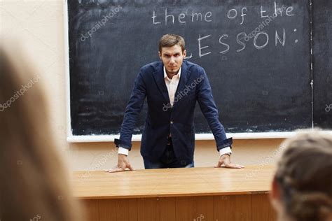 Evil teacher at the blackboard with the words — Stock Photo ...