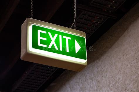 Illuminated Green Exit Sign with an Arrow Stock Photo - Image of icon ...