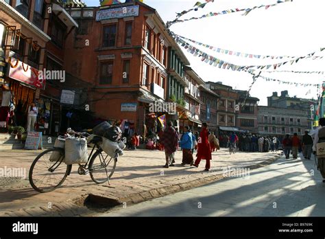 Local People Walk And Shop Around Boudhanath Stupa In Kathmandu Nepal