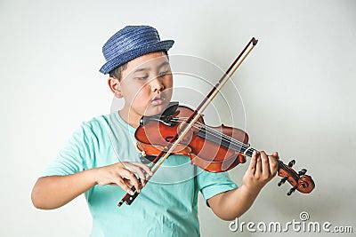 Children Playing Violin Instruments In The Classroom Stock Photo ...