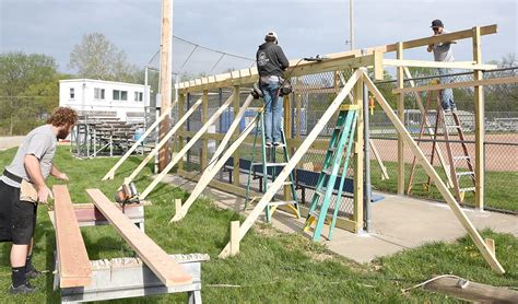 Jay Hunter Construction builds new roof on dugout - Farmer Publishing