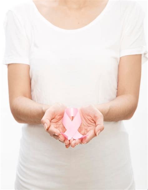 Premium Photo Midsection Of Woman Holding Breast Cancer Awareness