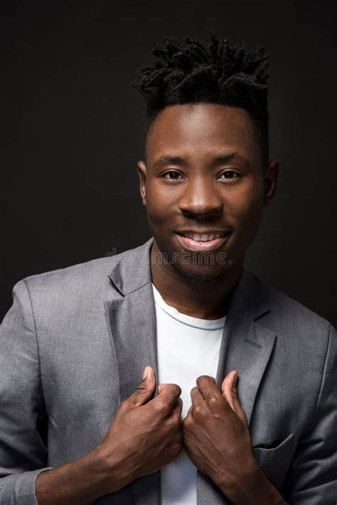 Close Up Portrait Of Handsome Black Man With Charming Smile Studio