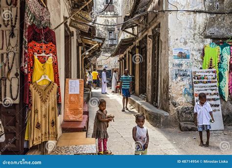 Local People On A Typical Narrow Street In Stone Town Zanzibar