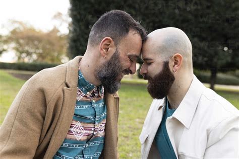 Loving Gay Couple Embracing Each Other In Park Stock Photo