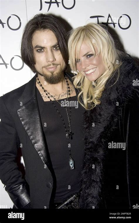 Musician Dave Navarro and girlfriend Lindsey Hartley walk the red carpet at the nightclub Tao in ...