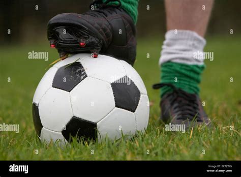 Soccer Football Player With Foot On The Ball Ready To Take A Kick Stock