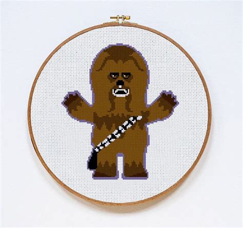 A Cross Stitch Star Wars Character Is Depicted In A Hoop