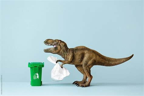 Dinosaur Taking Out The Trash By Stocksy Contributor Ruth Black