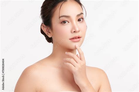 Beautiful Young Asian Woman With Clean Fresh Skin On White Background