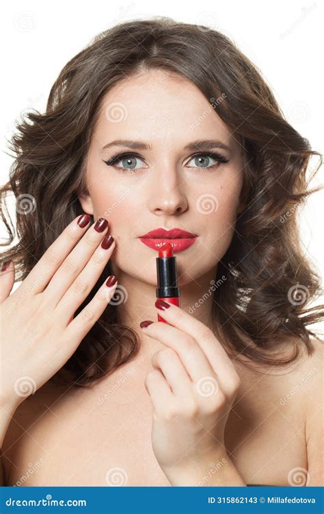 Cute Brunette Woman Holding Red Lipstick In Hand With Dark Red