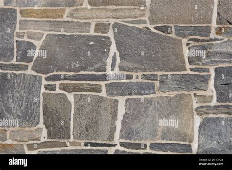 Stone Wall Of Building With Distinctive Grout And Fun Design Stock