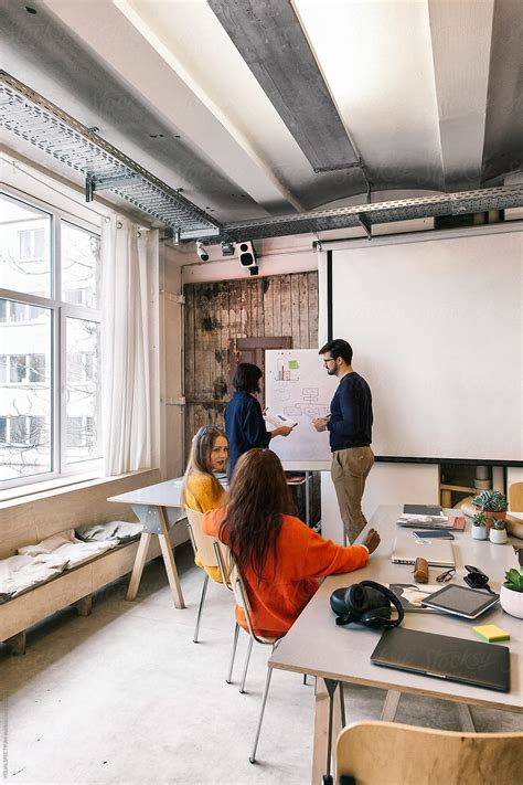 "Corporate Teamwork - Group Of Young People Working Together In