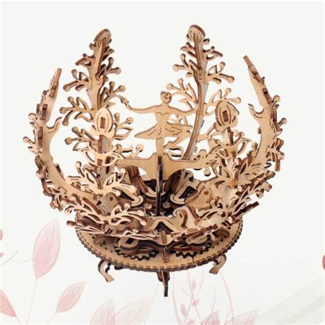 An Intricate Wooden Sculpture Is Displayed On A White Background