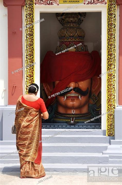 Singapore An Indian Woman Praying At Sri Mariamman Hindu Temple In