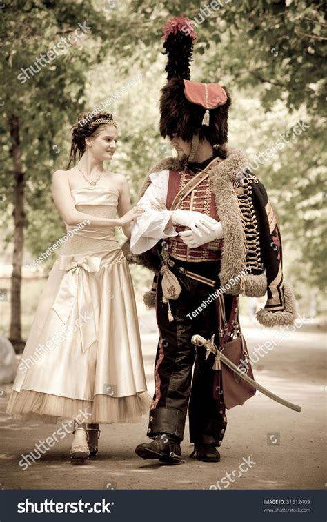 Russian Hussar In Vintage Outfit With Pretty Woman. Stock Photo ...