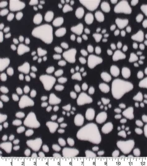 Blizzard Fleece Fabric Paw Prints On Black By Joann Joann X Ribblr