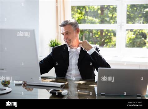 Businessman Working During Hot Weather In The Office Stock Photo Alamy