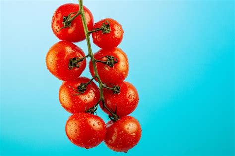 Premium Photo Bunch Of Fresh Red Tomatoes Levitation With Green Stems