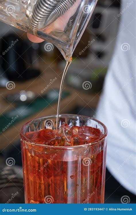 Preparation Of An Alcoholic Cocktail With Ice And Whiskey Stock Image