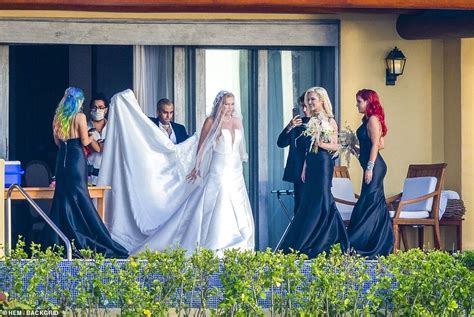 Bella Thorne Puts On A Cheeky Display In Bikini Before Changing Into Plunging Bridesmaid Gown