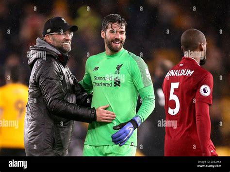 Liverpool Manager Jurgen Klopp Left Goalkeeper Alisson Becker And