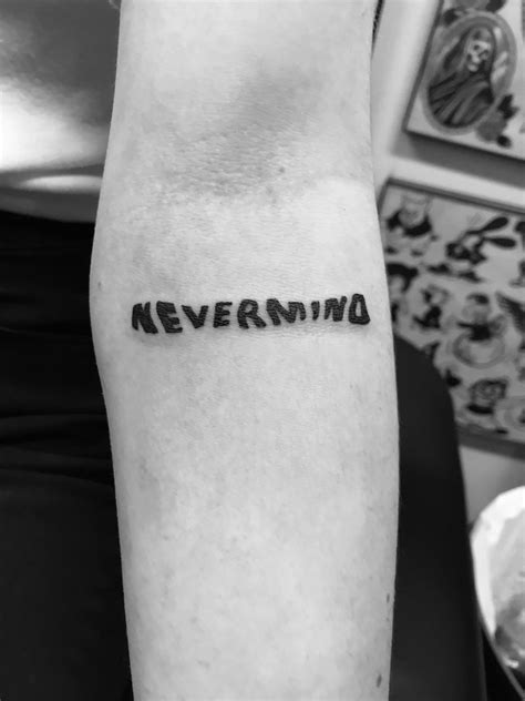 Nirvana Nevermind lettering tattoo | Subtle tattoos, Nirvana tattoo ...