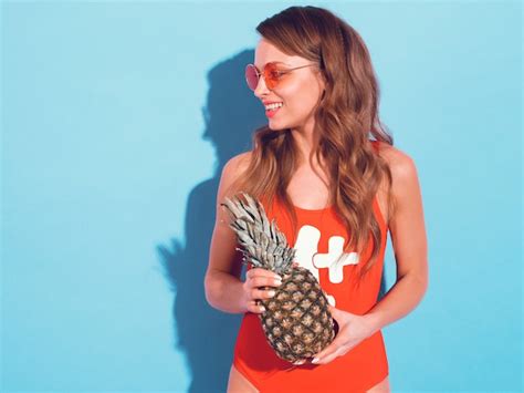 Free Photo Portrait Of Smiling Brunette Girl In Summer Red Swimwear Clothes And Round