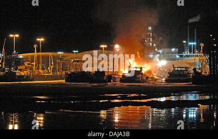 An Oil Tanker Is On Flames In The Harbour Of BP Refinery In Lingen