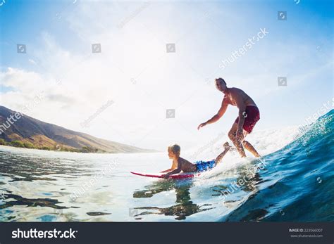 Action Sports Father And Son Surfing Together Ppt Template 7