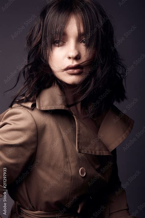 Dark Portrait Of Attractive Sensual And Hot Woman With Nude Makeup Dark Wavy Hair Wearing