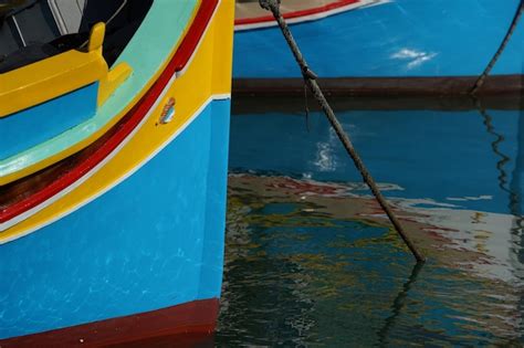 Premium Photo Malta Colorful Painted Fishing Boat In Marsaxlokk Village