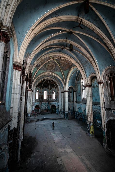 Man Standing Inside Abandoned Building · Free Stock Photo