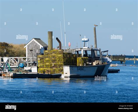 A Lobster Boat Prepares To Unload Traps For Winter Storage Sesuit