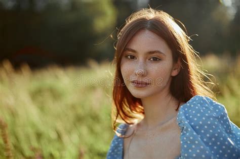 Close Up Of A Charming Young Woman Wears Blue Dress In The Sun Rays