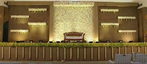 Reception Stage Decor with Beautiful Wall Lights and Hanging Flowers