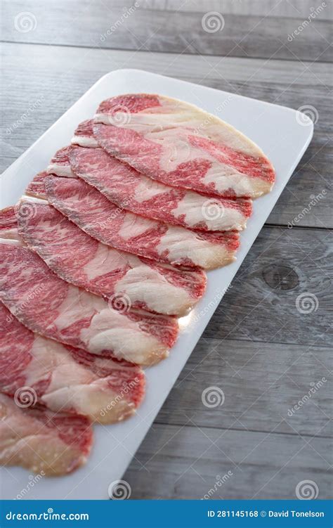 Plate of Raw Slices of Wagyu Beef Brisket Stock Photo - Image of ...