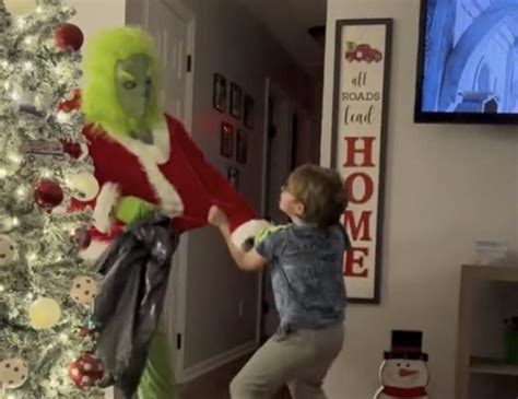 Kid Aggressively Fights Off 'Christmas Grinch' As He Enters House