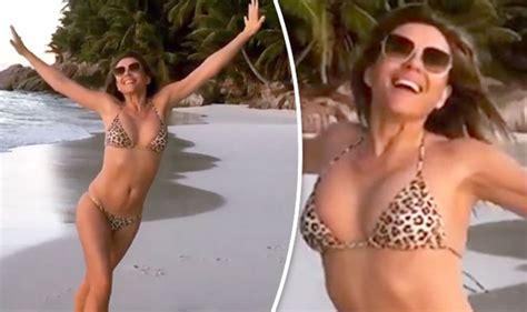 Elizabeth Hurley Flaunts Ample Assets As She Channels Baywatch In Slo