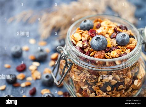 Homemade Granola In Jar And Fresh Blueberry Healthy Breakfast Of