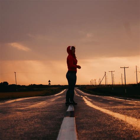 Premium Photo Full Length Of Woman Standing On Road Against Sky