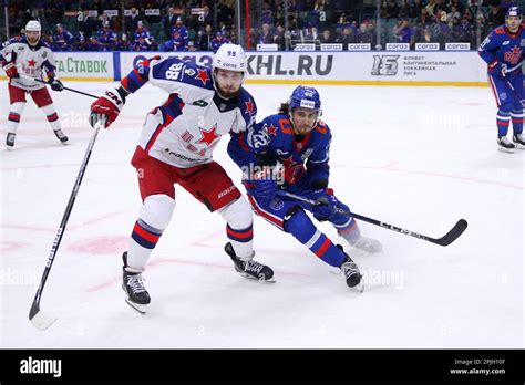 CSKA Hockey Club player, Maxim Mamin (No.98) and SKA Hockey Club player, Marat Khusnutdinov (No ...