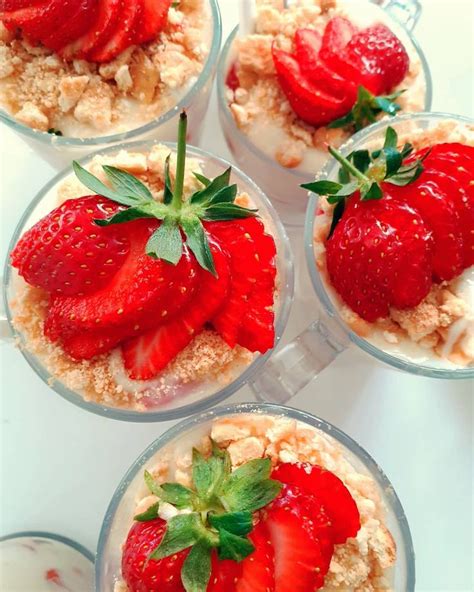 Four Desserts With Strawberries And Oatmeal In Them