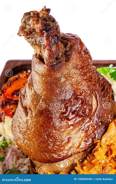 European Czech Cuisine Pork Knuckle On A Wooden Board With Mashed Potatoes Stewed Cabbage