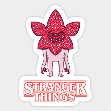 A Sticker With The Words Strange Things In Red And Pink On It S Face