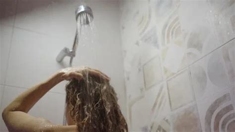 Naked Woman Washing Her Hair In The Show Stock Video Pond