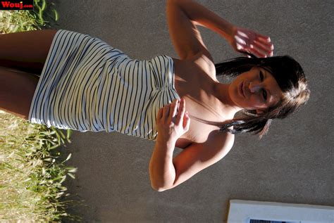 Lovely Brunette Babe Posing In A White Dress Outdoors Photos